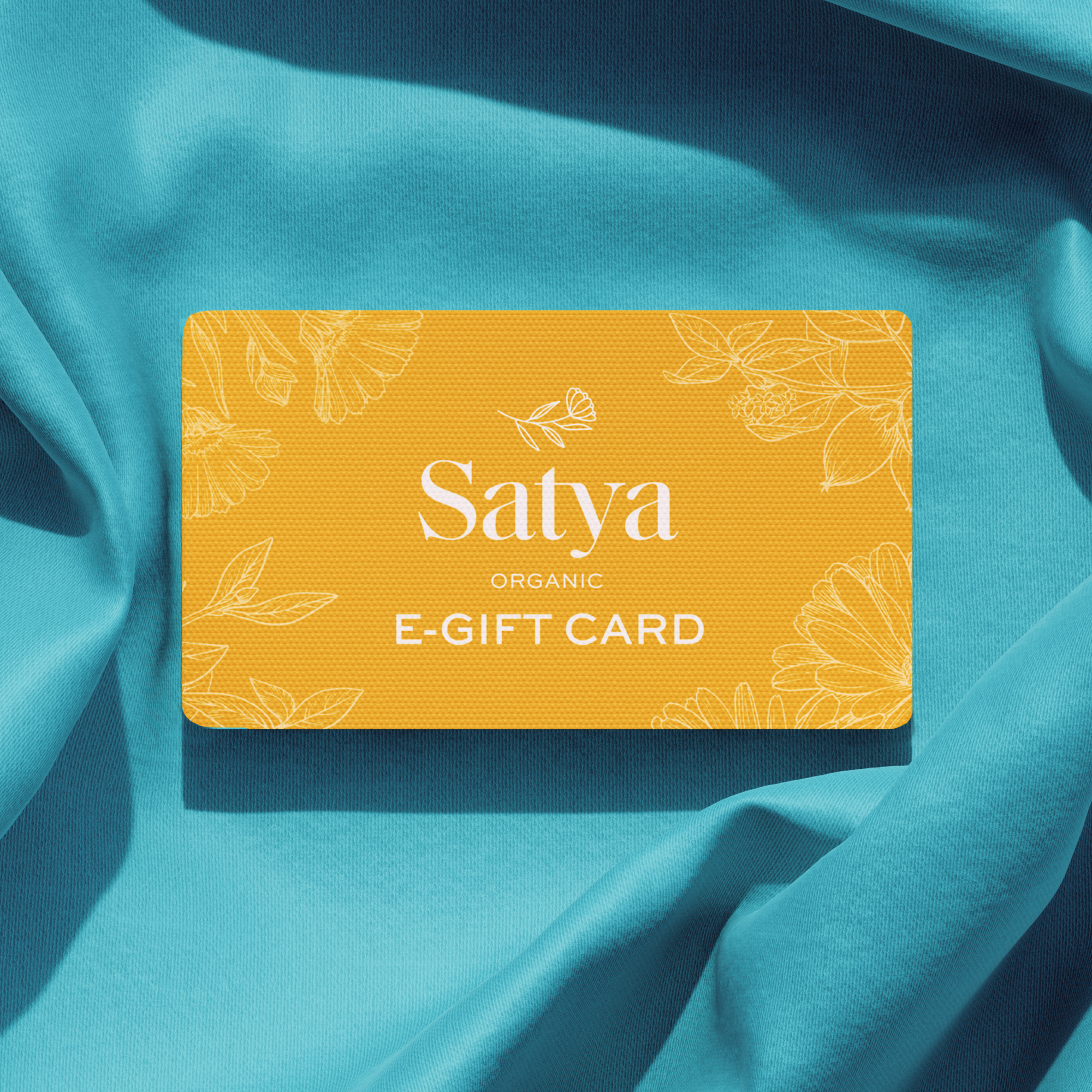 Satya Organic E-Gify Card on a blue cloth