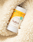Satya Organic Natural Skin Care Eczema Easy Glide Stick snuggled in a blanket