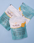 Three Satya Organic Calendula Flower Oat Bath packages in a pile